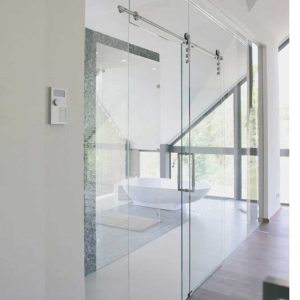 Kit coulissant sur rail inox rond pour porte en verre